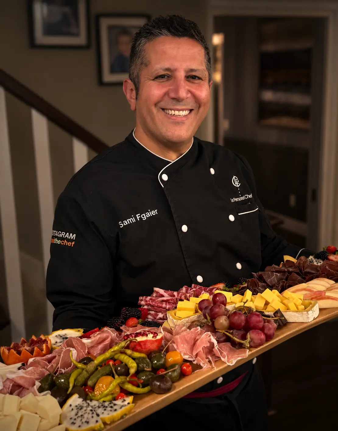 Chef cooking over a stove in a professional kitchen.