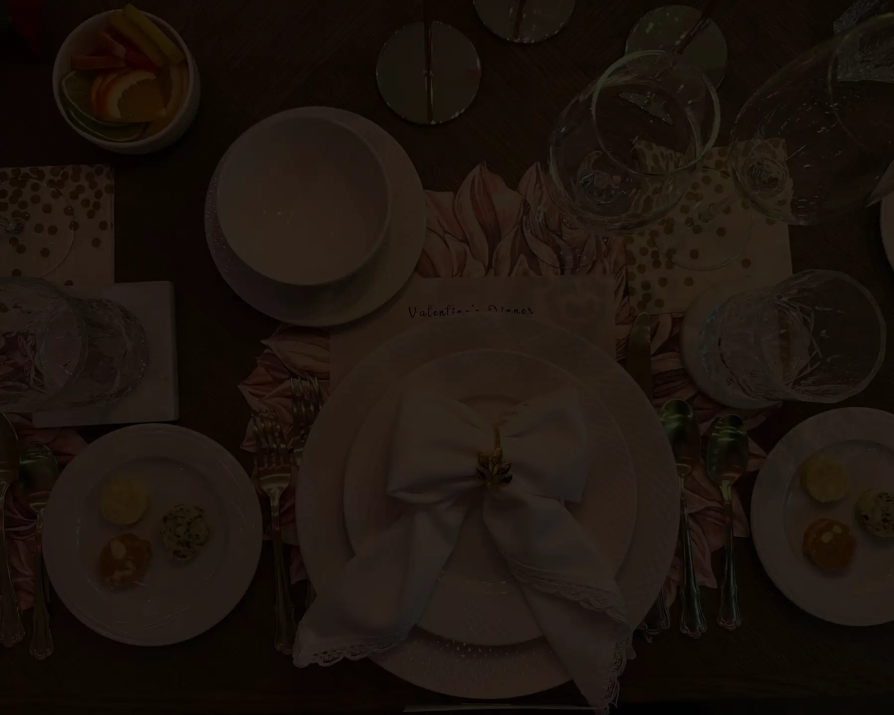 An intimate private dining table set with plates and glassware.